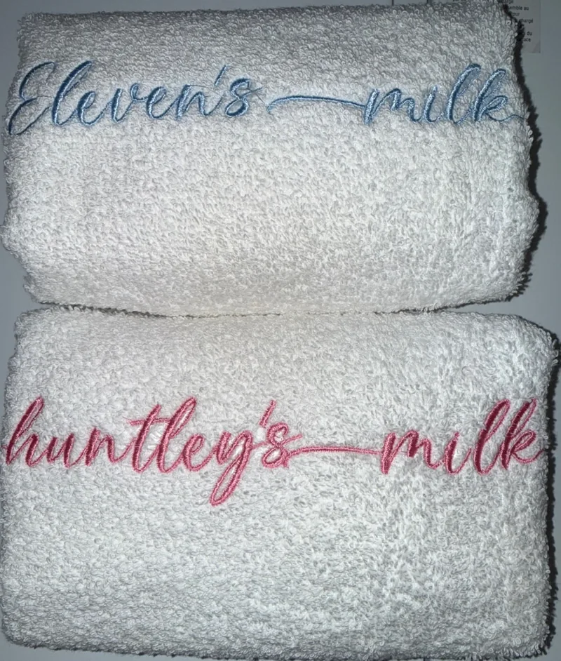 Personalized embroidered milk towels for newborn keepsakes
